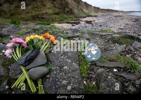 Gardai (police) have named the newborn dead baby, found on Bells Beach in County Dublin, as 'Baby Bell'. They have also appealed again to the mother of the infant to come forward in confidence and get medical help. The baby was discovered on Saturday morning by a beach cleaner, partly covered in the sand, in Balbriggan, county Dublin. The case has brought back memories in Ireland of similar cases in the 1980's of young women giving birth and losing their babies in secret, due to the fear of scandal. Photo shows flowers and a painted angel at the scene. Photos: Eamonn Farrell/RollingNews.ie Stock Photo