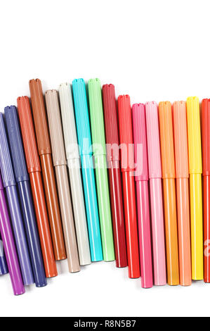 Colored felt tip pens in a row on white background. Stock Photo