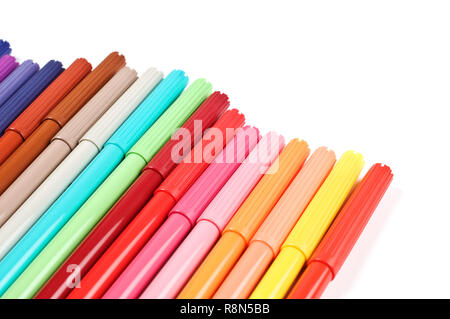 Colored felt tip pens in a row on white background. Stock Photo