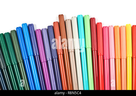 Colored felt tip pens in a row on white background. Stock Photo