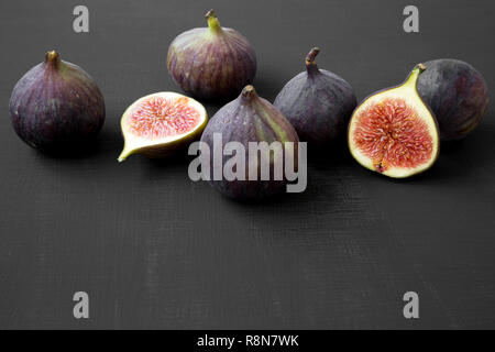 Fresh figs on black background, side view. Closeup. Stock Photo
