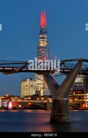 London, UK. 12th Dec 2018. The Shard London Christmas light show 2018, the Millennium bridge is in the foreground, a nighttime long exposure. Stock Photo