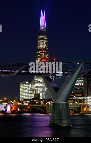 London, UK. 12th Dec 2018. The Shard London Christmas light show 2018, the Millennium bridge is in the foreground, a nighttime long exposure. Stock Photo