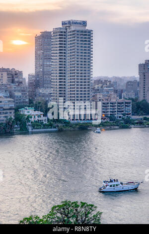 Sunset scene from the top of cairo tower in Egypt shows the nile , the ...