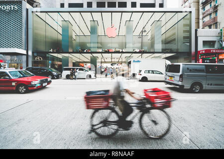 Tsim Sha Tsui, Hong Kong - Dec 6, 2018: Apple store shop front on Canton road shopping street, in Tsim Sha Tsui area with cars, bicycle, and city life Stock Photo