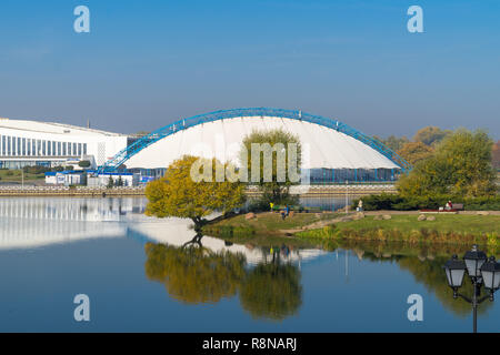 Seasonal ice skating rink in air dome. Embankment of the Svisloch river Stock Photo