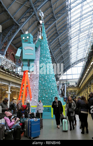 Tiffany & Co Christmas tree and robot and people in the shopping mall area at St Pancras International Railway Station in London UK  KATHY DEWITT Stock Photo