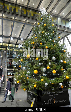 Vertical view of large Christmas tree with glass baubles decorations outside the Leadenhall office building in the City of London UK  KATHY DEWITT Stock Photo