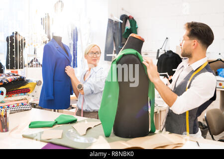 Fashion Designers Working on Clothing Stock Photo