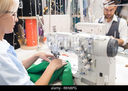 Seamstress at Sewing Machine Stock Photo