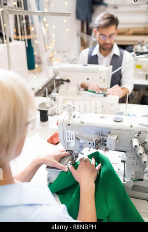 Tailors Sewing in Atelier Stock Photo