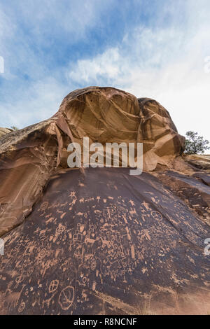 Newspaper Rock State Historic Monument, with a huge panel of old petroglyphs pecked into desert varnish, near the Needles District of Canyonlands Nati Stock Photo