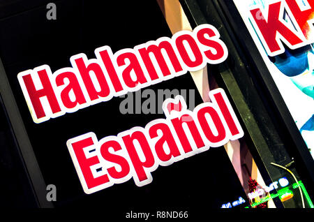 A sign announces that Spanish is spoken at a business on Buford International Highway in Doraville, Georgia, May 28, 2014. Stock Photo