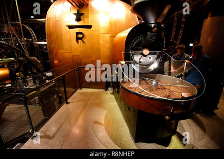 Workers at Starbucks Reserve Roastery New York roasting an in-store specialty coffee on a 25lb Probat coffee roaster Stock Photo