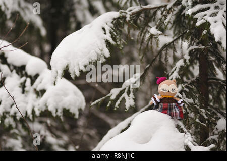 SYKTYVKAR, RUSSIA - DECEMBER 16, 2018: Illustrative image. Sleeping owl toy knitted in the technique of knitting amigurumi Stock Photo