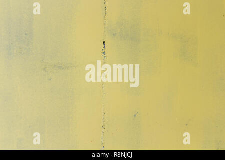 Iron wall with a weld seam in the middle of gray. Texture background Stock Photo