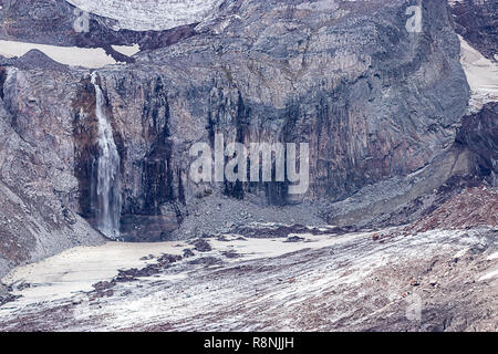 waterfall crashing down into valley from glacial fields near mount rainier Stock Photo
