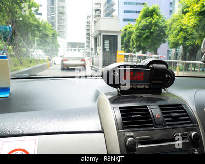 View from cab with meter display Time, Distance and Fare in dashboard interior Stock Photo