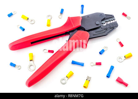 Crimping tool and electrical connectors isolated on white background closeup Stock Photo