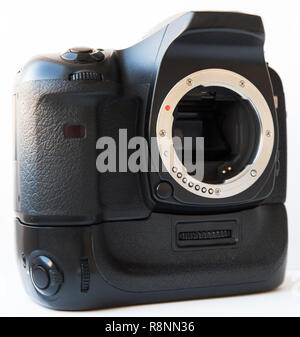 Digital SLR camera with lens and vertical battery grip isolated Stock Photo