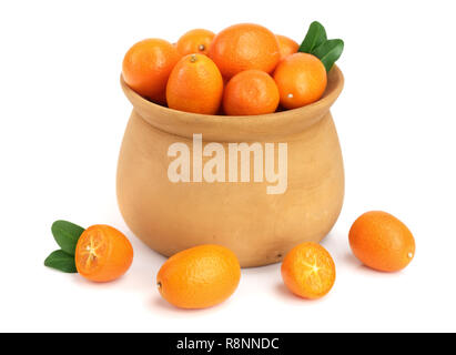 Cumquat or kumquat with leaf in wooden bowl isolated on white background close up Stock Photo