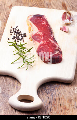 raw dry aged steak on wood Stock Photo