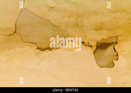 Rusty bath with peeling enamel. Repair is required. Stock Photo