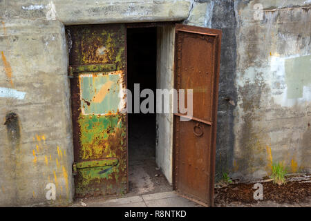 WA15544-00...WASHINGTON - A rusting door, entrance to a storage room in Battery Tolles at Fort Worden; now part of Fort Worden State Park. Stock Photo