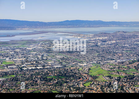 Aerial view of Fremont and Newark on the shoreline of east San Francisco bay area; Dumbarton bridge in the background; Silicon Valley, California Stock Photo