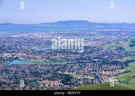 Aerial view of Fremont and other cities of east San Francisco bay; San Francisco and the bay bridge in the background; California Stock Photo