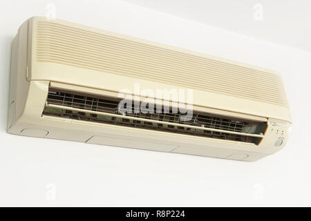 Split conditioner air mounted on a white wall. Home equipment Stock Photo