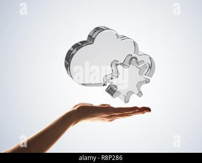 Cloud computing concept with glass symbol shown in hand Stock Photo