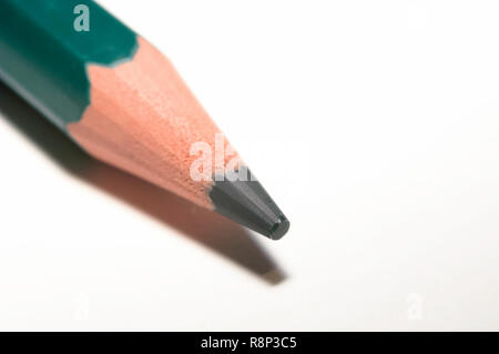 Macro of a green color pencil, isolated on white paper. Stock Photo