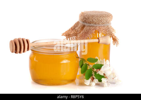 Jar of honey with flowers of acacia isolated on white background Stock Photo
