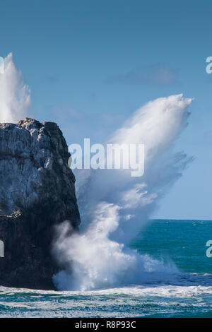 Crashing waves and flying spray on rocks at Piedras Blancas, San Simeon, CA; USA Stock Photo