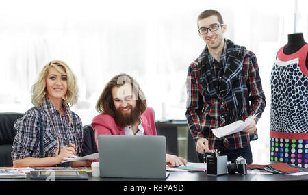 group of designers discussing new ideas in a modern Studio Stock Photo