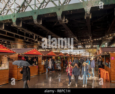 Southbank Winter Market (Christmas Market) under the Hungerford Bridge, London, UK. Stock Photo