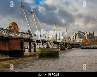 Hungerford Bridge and Golden Jubilee Bridges over the river Thames, London, UK. Stock Photo