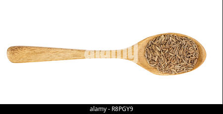 Cumin or caraway seeds in wooden spoon isolated on white background. Top view Stock Photo