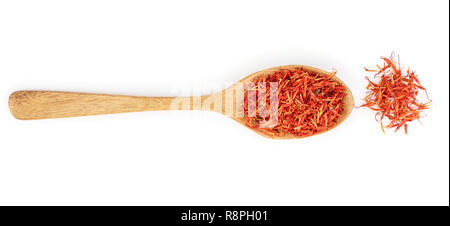 Heap of saffron in wooden spoon isolated on white background. Top view. Flat lay Stock Photo