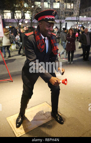 Salvation Army soldier performs for collections in midtown Manhattan Stock Photo