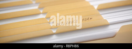 Yellow folders with labels and paper in a row Stock Photo