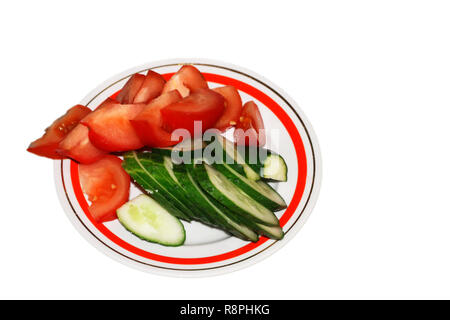 Sliced tomato and cucumber on the plate isolated Stock Photo