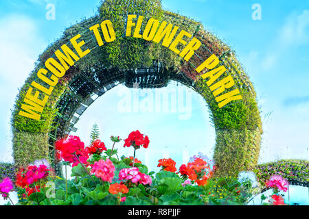 Flower gate with text: 'Welcome to flower park' attracts tourists to visit the tourist city of Da Lat, Vietnam. Stock Photo