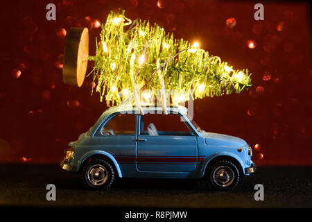 Car delivering Christmas or New Year tree Stock Photo