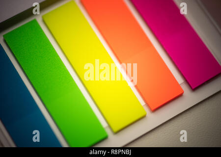 blurred background multicolored notes in a notebook with a white background Stock Photo