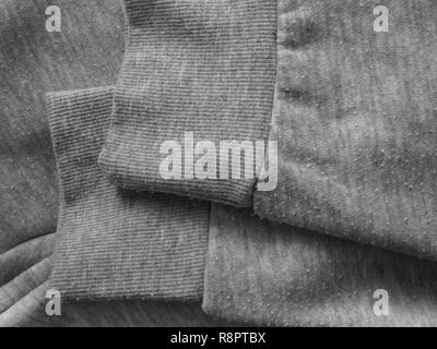 Pills on the heather gray sweatshirt cotton knit fabric. Bobbles on the knitwear. Stock Photo