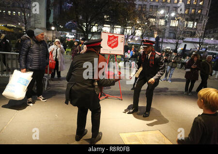 Salvation Army soldier performs for collections in midtown Manhattan Stock Photo