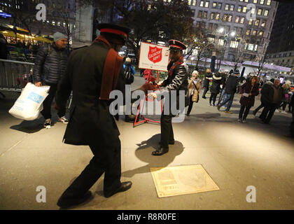 Salvation Army soldier performs for collections in midtown Manhattan Stock Photo