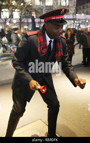 Salvation Army soldier performs for collections in midtown Manhattan Stock Photo